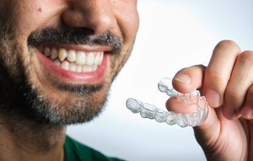 invisalign holden | man with aligners