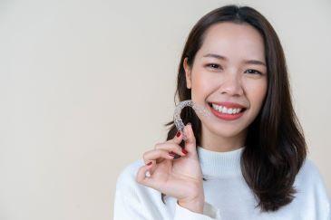invisalign rutland | woman with aligners